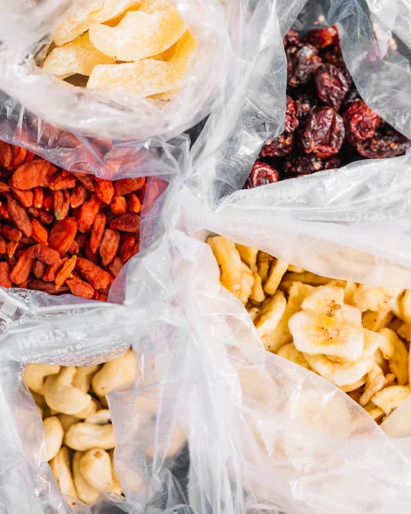 Dried fruits and nuts in open transparent bags