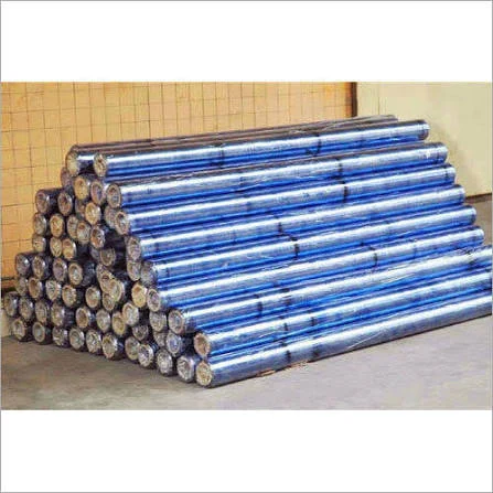 Blue-tinted packaging film rolls stacked horizontally on cardboard cores