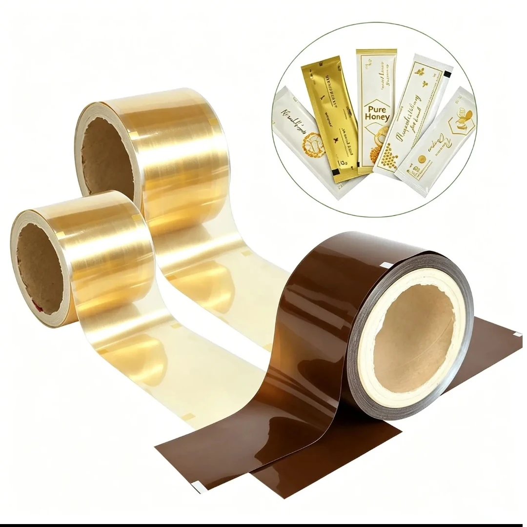 Supplied product image showing gold and brown printed packaging film rolls and sachets