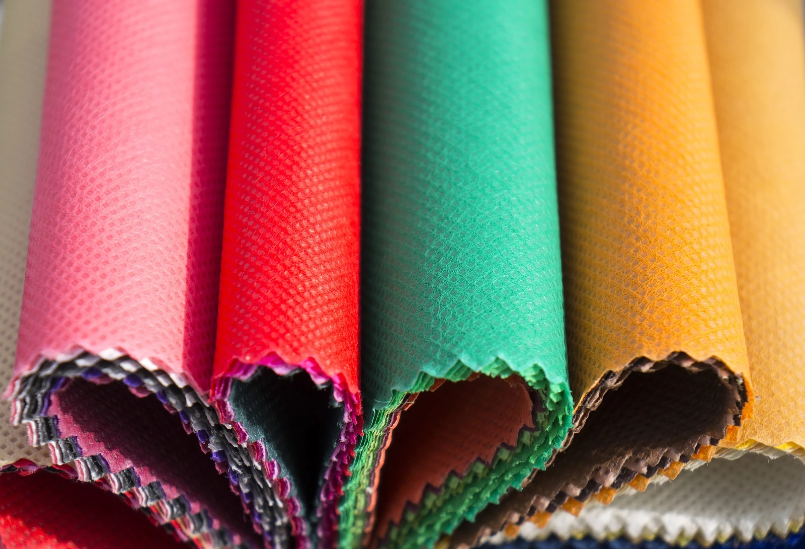 Real photograph of coloured non-woven fabric swatches