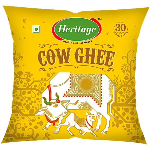 Heritage cow ghee in a yellow printed flexible pouch