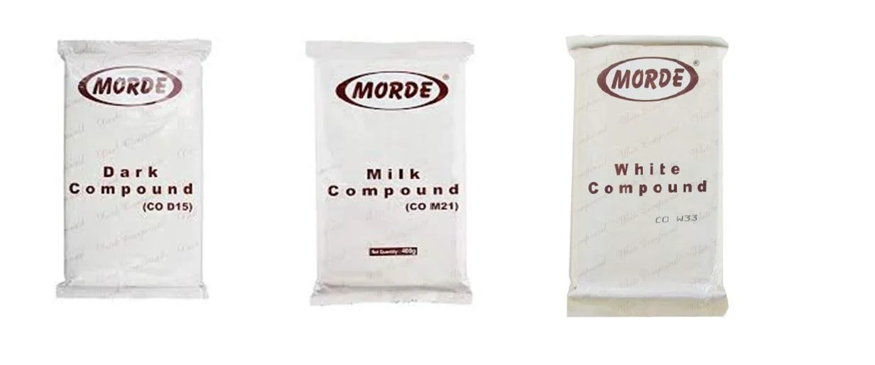 Three Morde compound chocolate slabs in printed covers