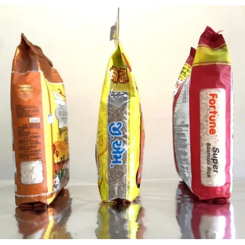 Three printed flexible bags showing gusset depth and product windows
