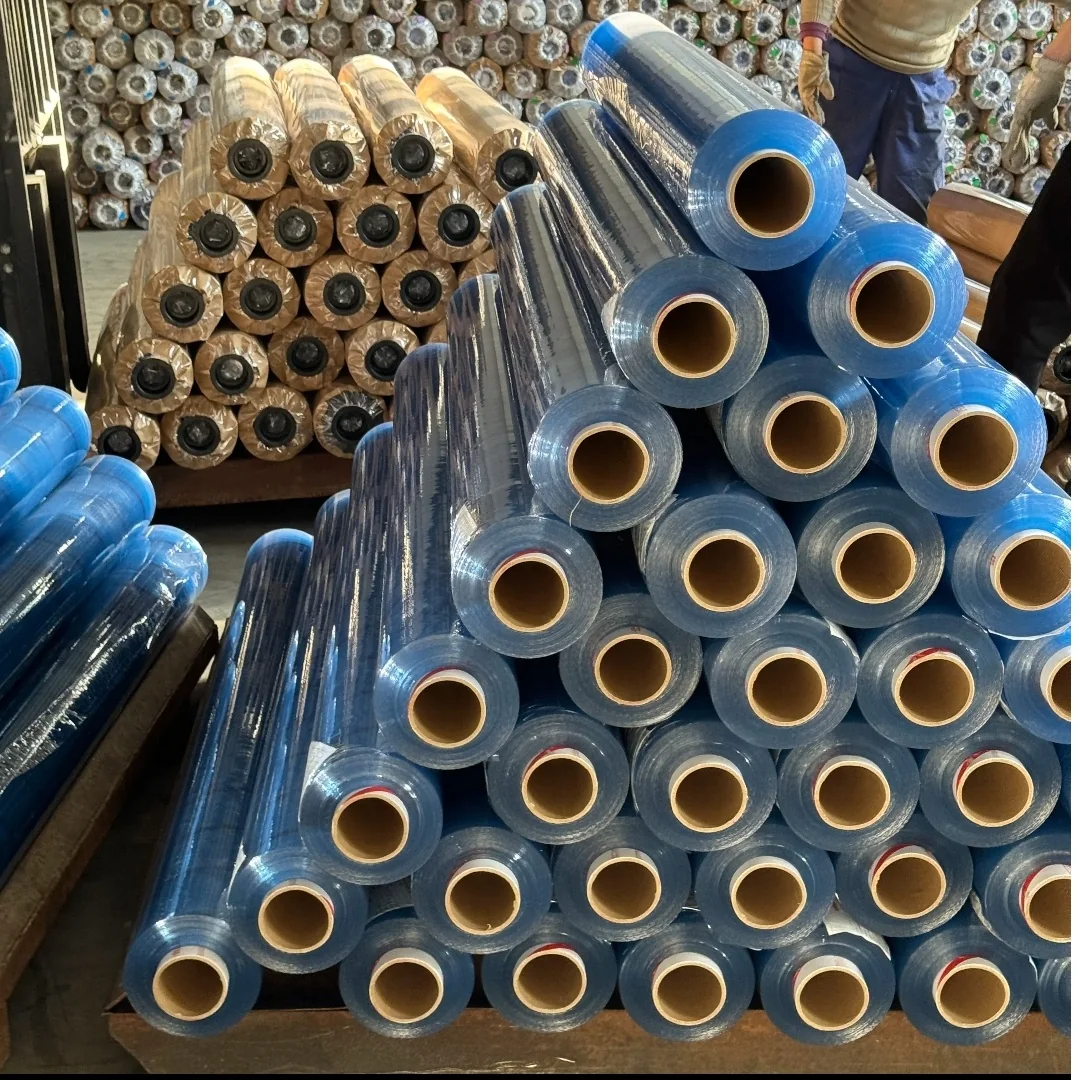 Blue protective film rolls stacked with their cardboard cores facing forward
