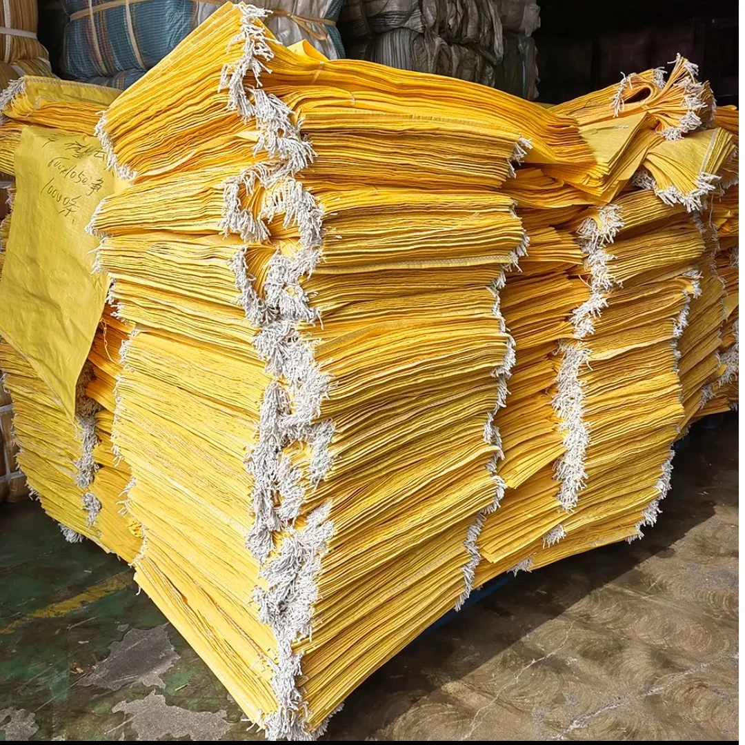 Bundles of yellow woven sacks stacked together
