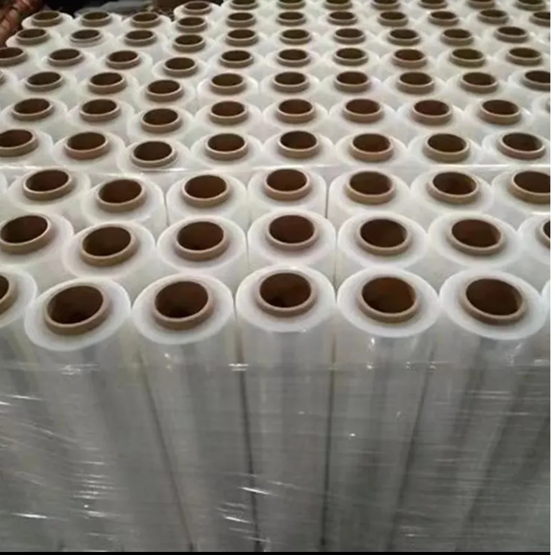 Top view of many clear film rolls with cardboard cores
