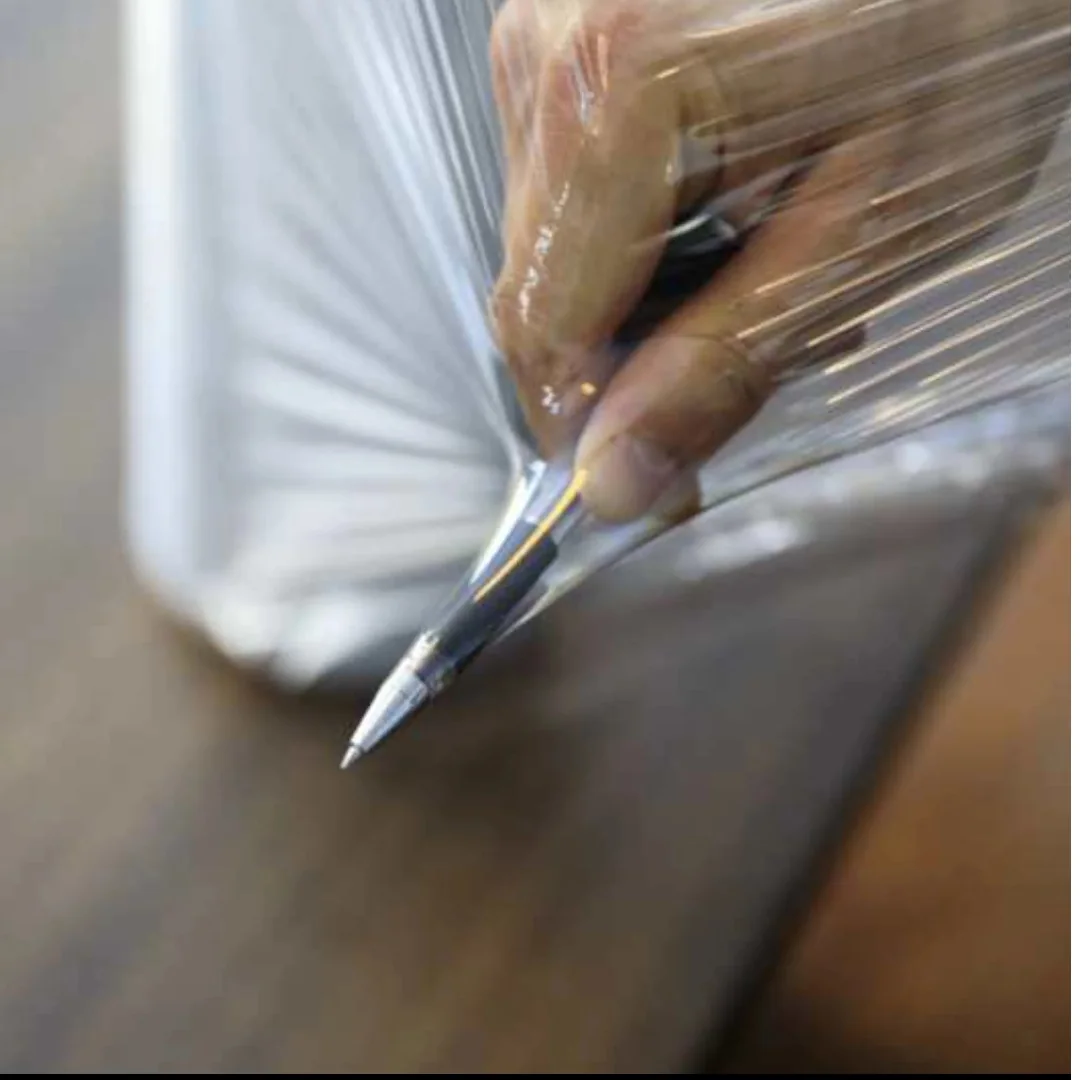 Close-up of clear packaging film stretched around a wrapped item