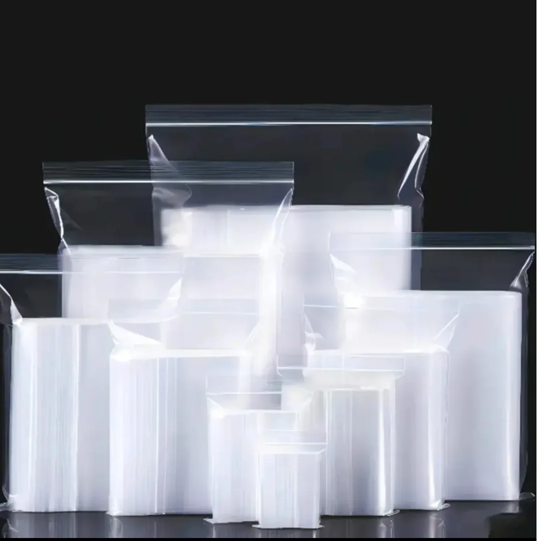 Assorted empty clear resealable bags displayed against a dark background