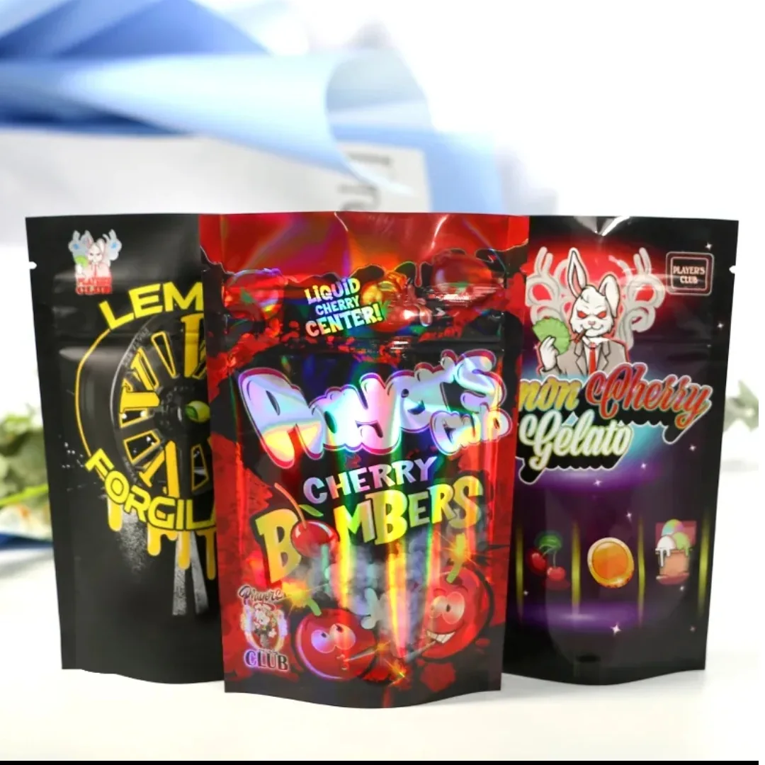 Three dark printed candy pouches displayed together