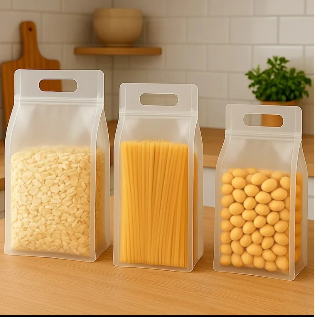 Frosted handled pouches containing grains pasta and round snacks