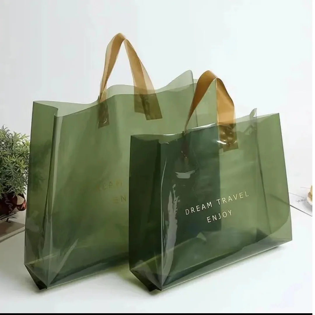 Green printed shopping bags with loop handles in two sizes