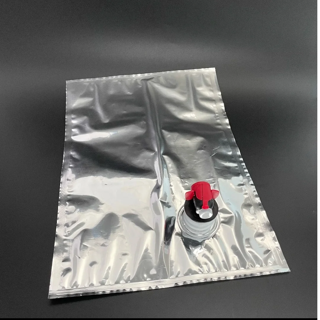 Silver bag-in-box liner with a red and black dispensing tap